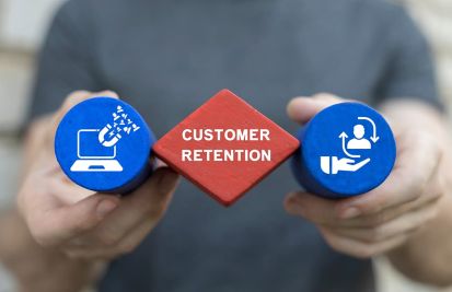 man holding customer retention icons