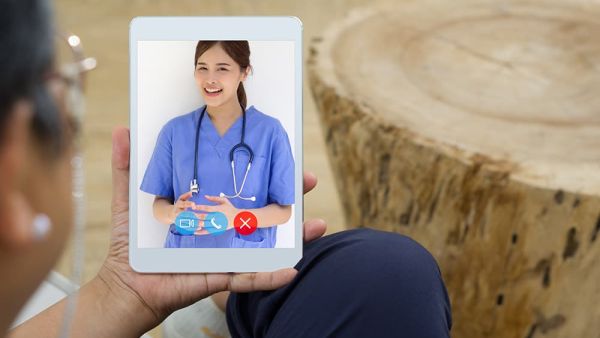 patient on a telehealth call with a female provider