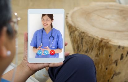 patient on a telehealth call with a female provider