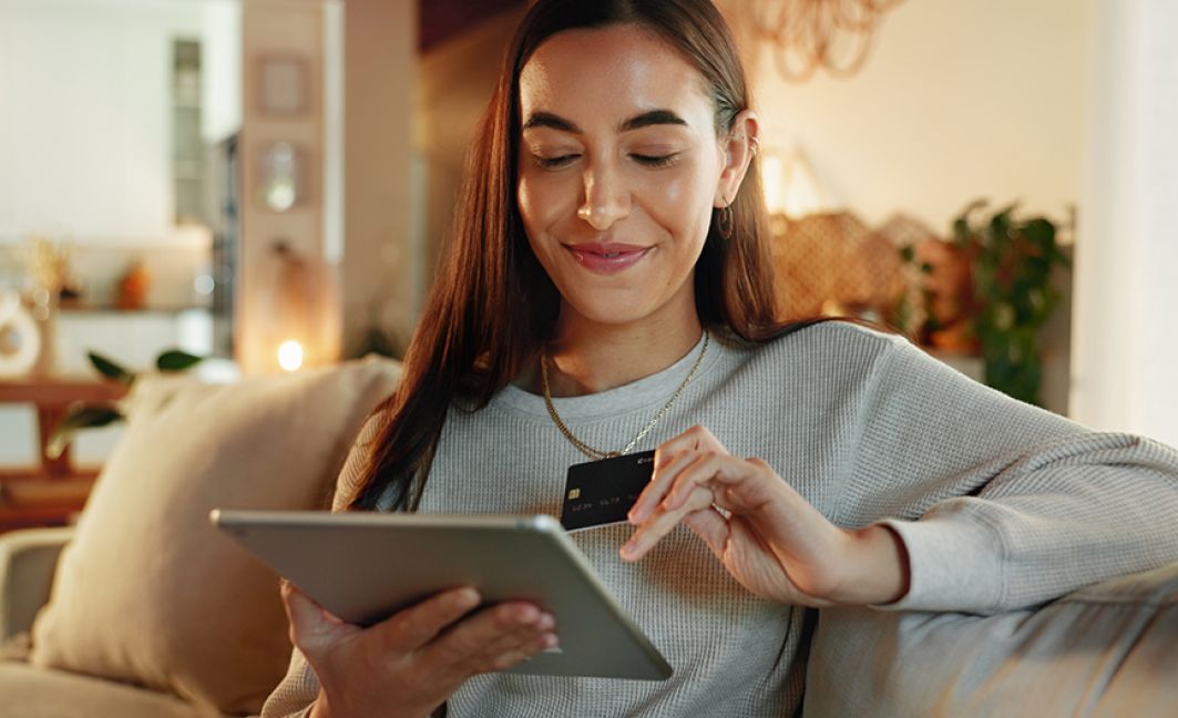 woman on laptop with credit card on ecommerce site