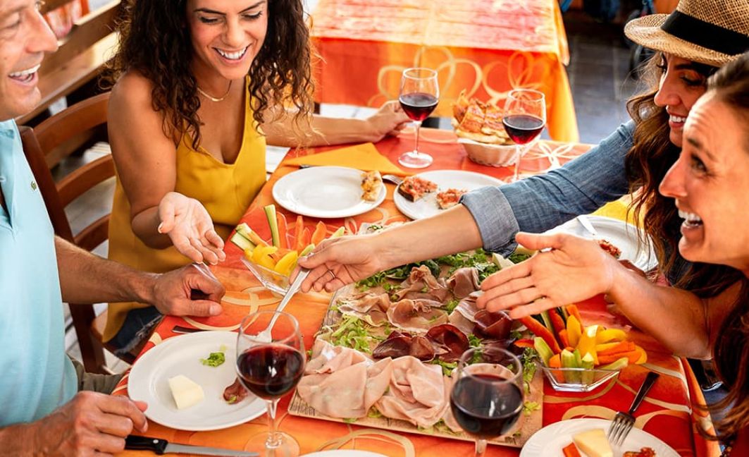 a group of millennials eating at a restaurant