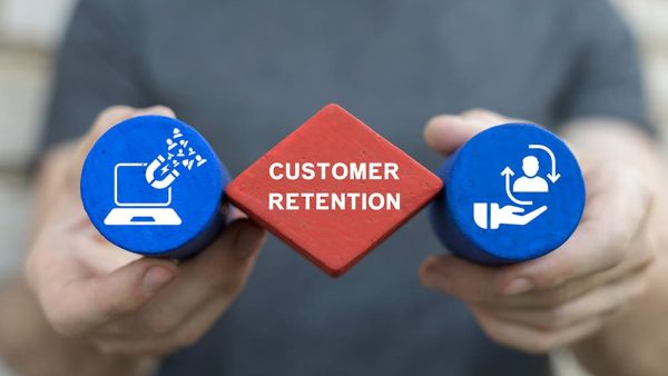 man holding customer retention icons