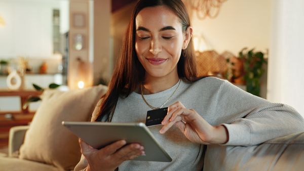 woman on laptop with credit card on ecommerce site